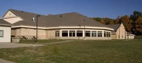 A single-storey commercial building among autumn trees